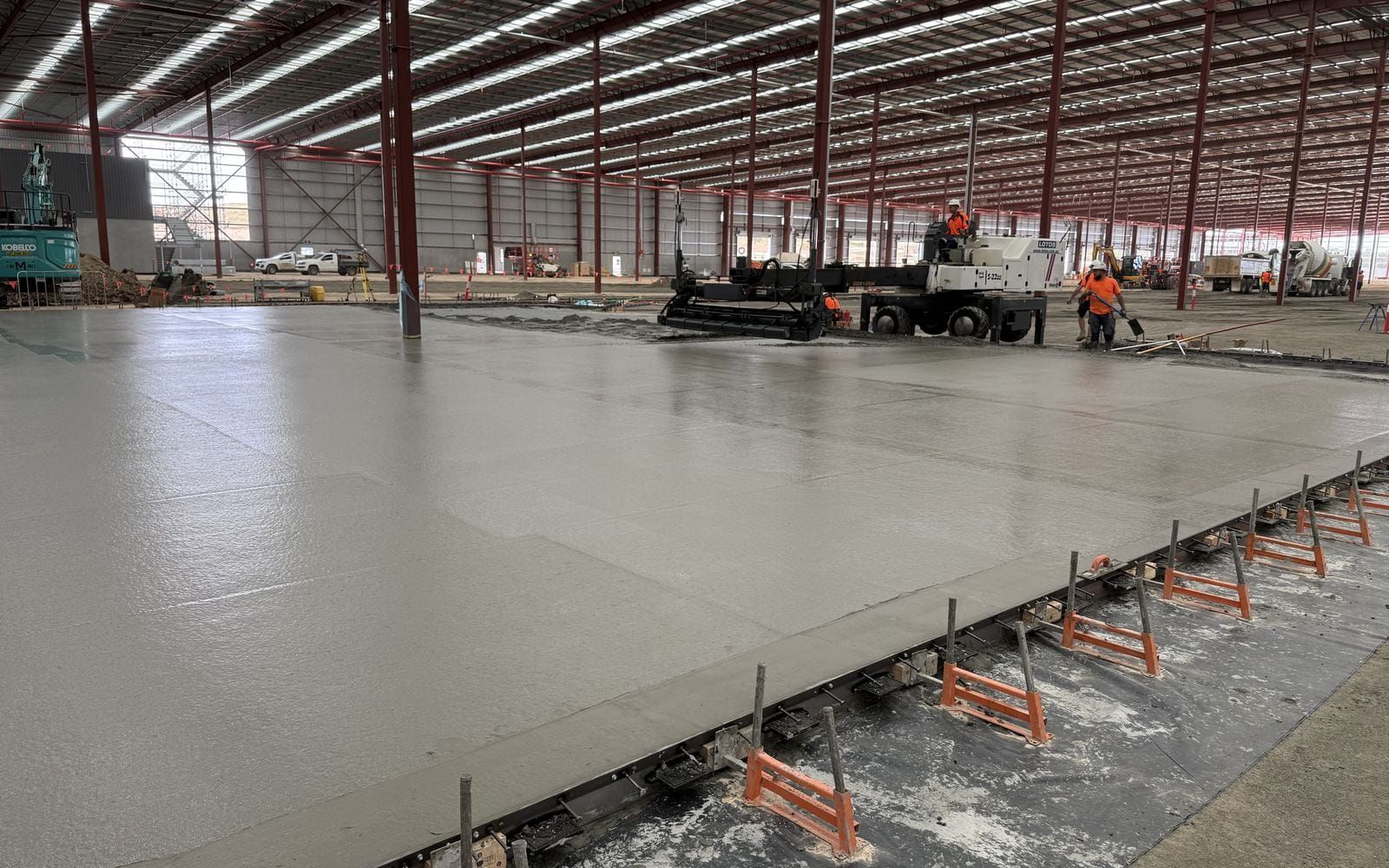 A finished super flat warehouse slab inside a completed shed