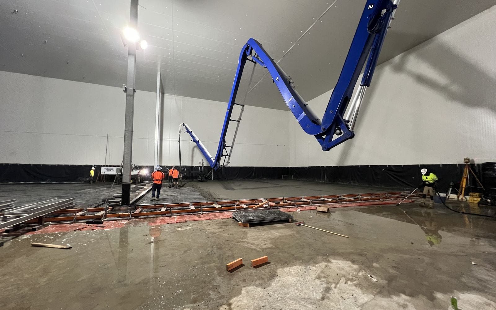 A ride-on power trowel burnishing the cold store floor