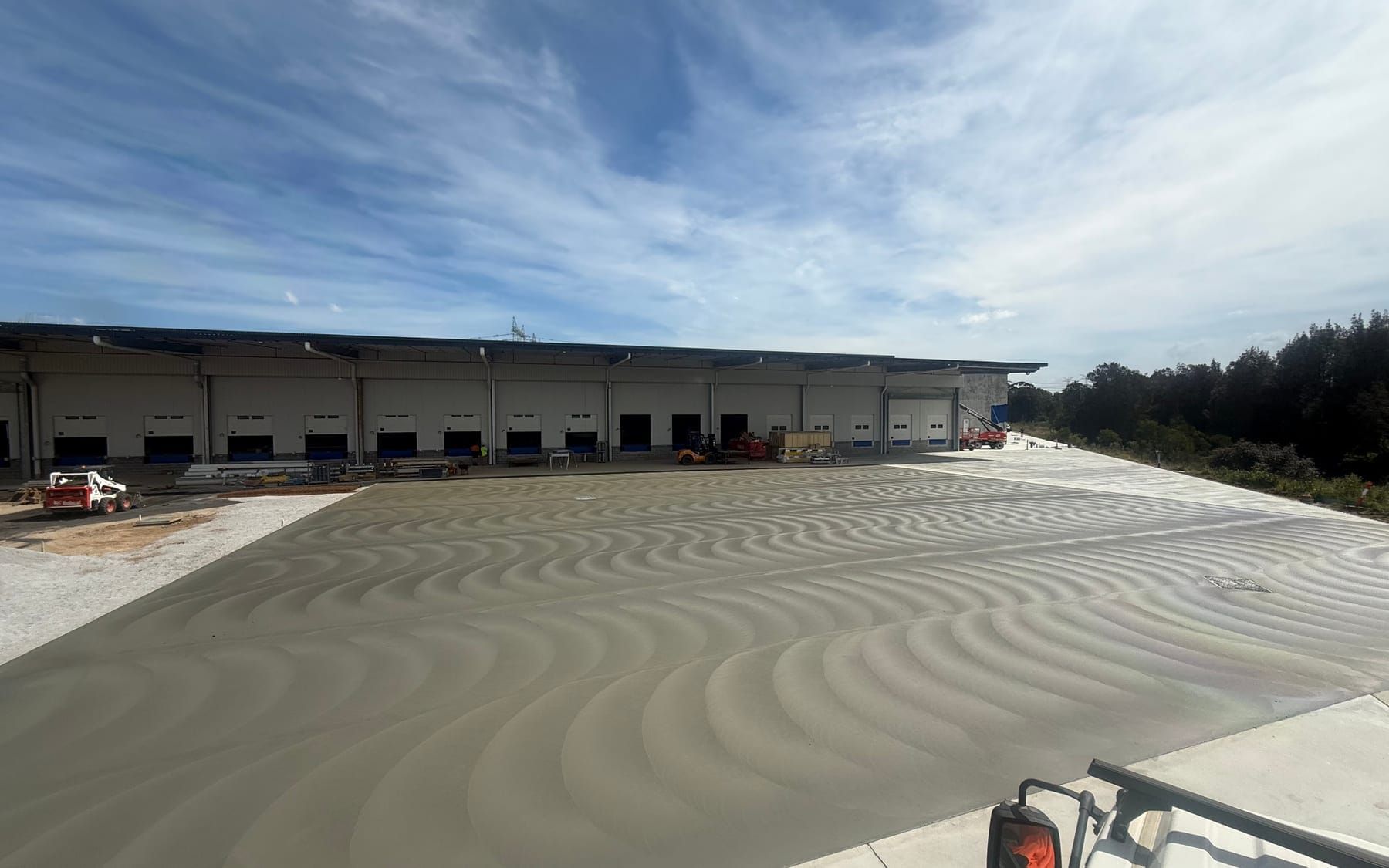 Freshly finished external pavement at the Minus 1 Minchinbury depot, with the bank of recessed loading docks behind