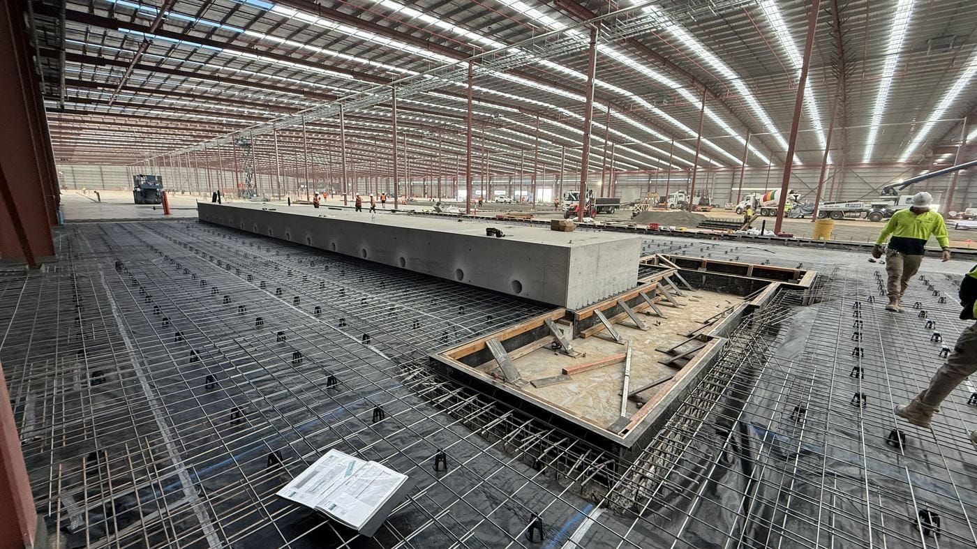 Drawings laid over fixed reinforcement ahead of a pour