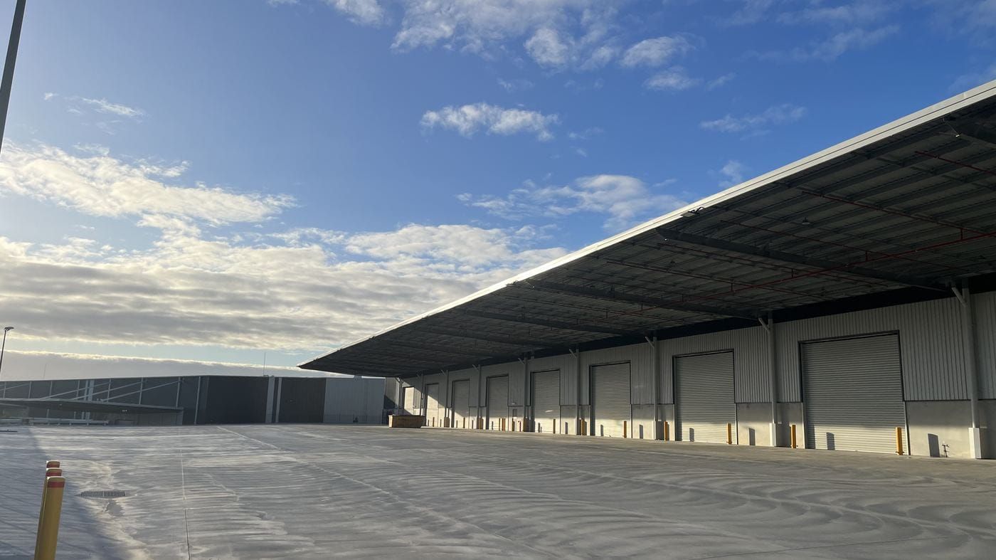 A completed external hardstand pavement running the length of a warehouse